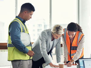 Process safety consultants reviewing documents during a facility study.